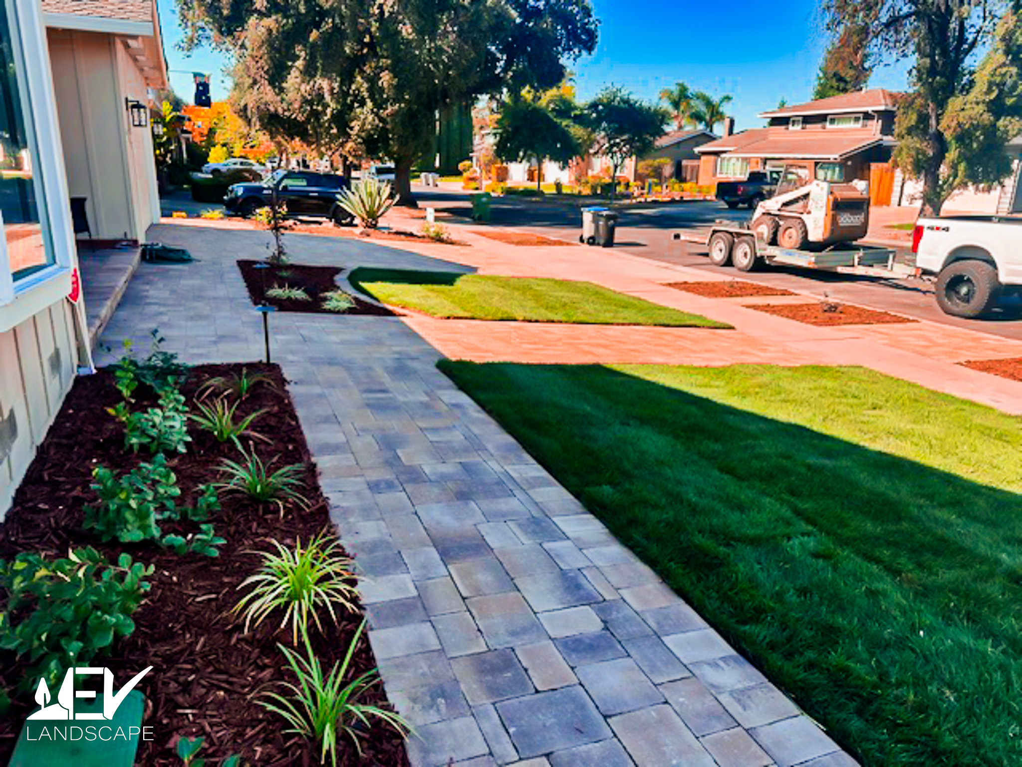 California native drought-tolerant plantscape with architectural agaves, decomposed granite, and river rock