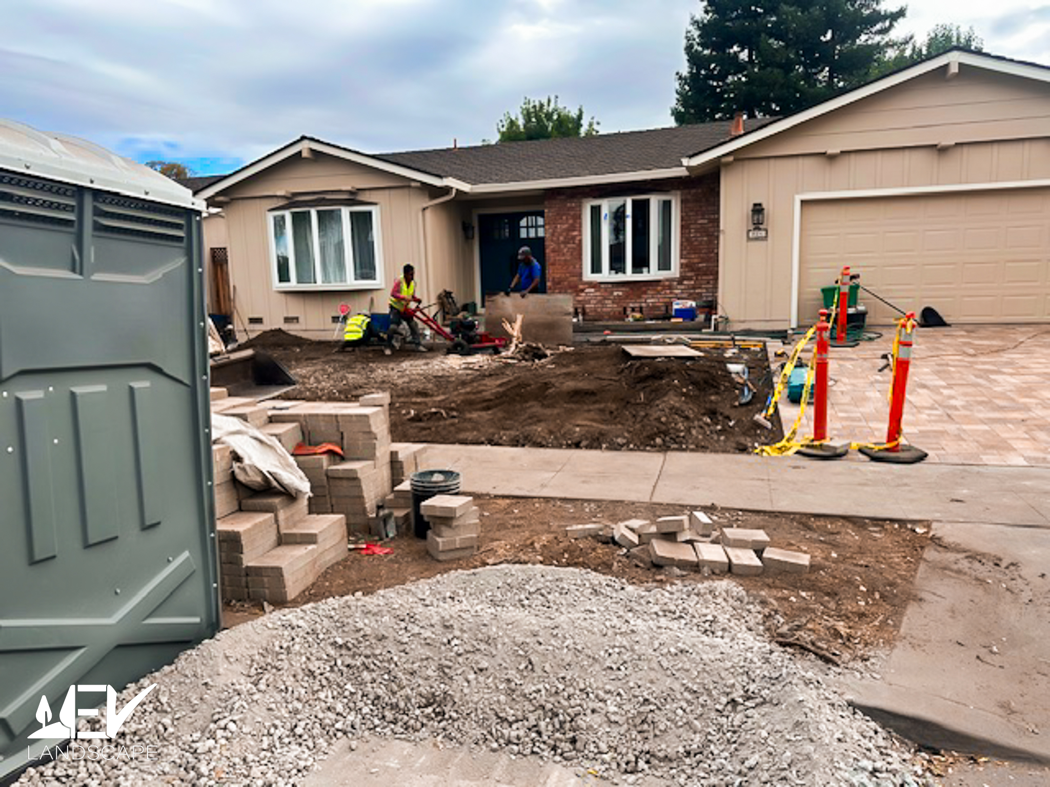 Custom flagstone paver walkway through estate grounds with manicured lawn and boxwood borders
